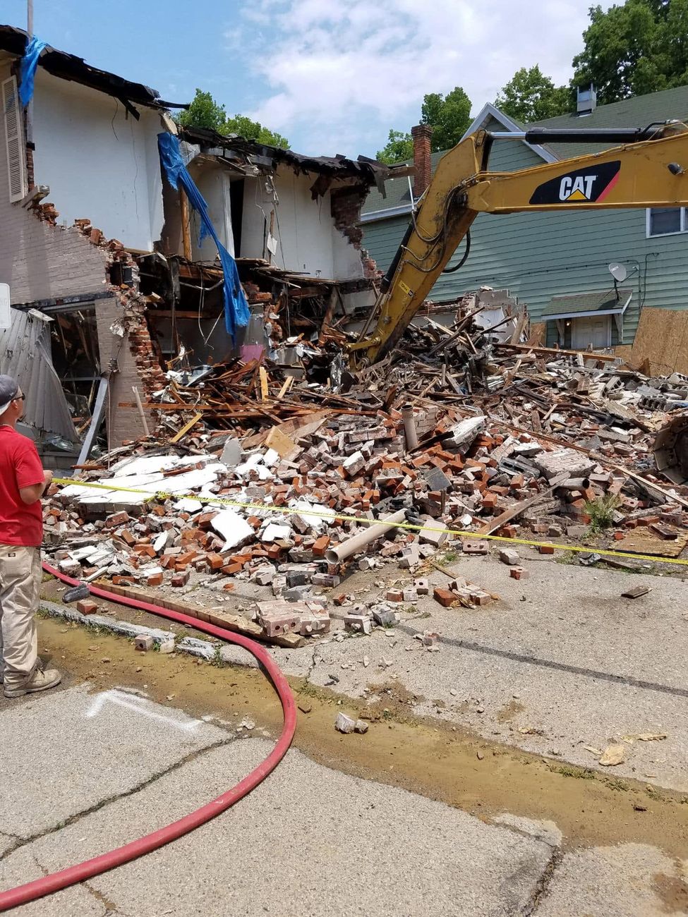 An excavator taking down a building