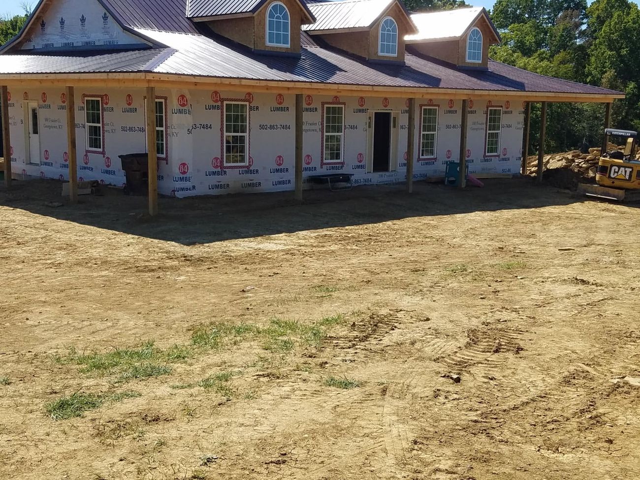 A building pad graded flat in front of a new structure